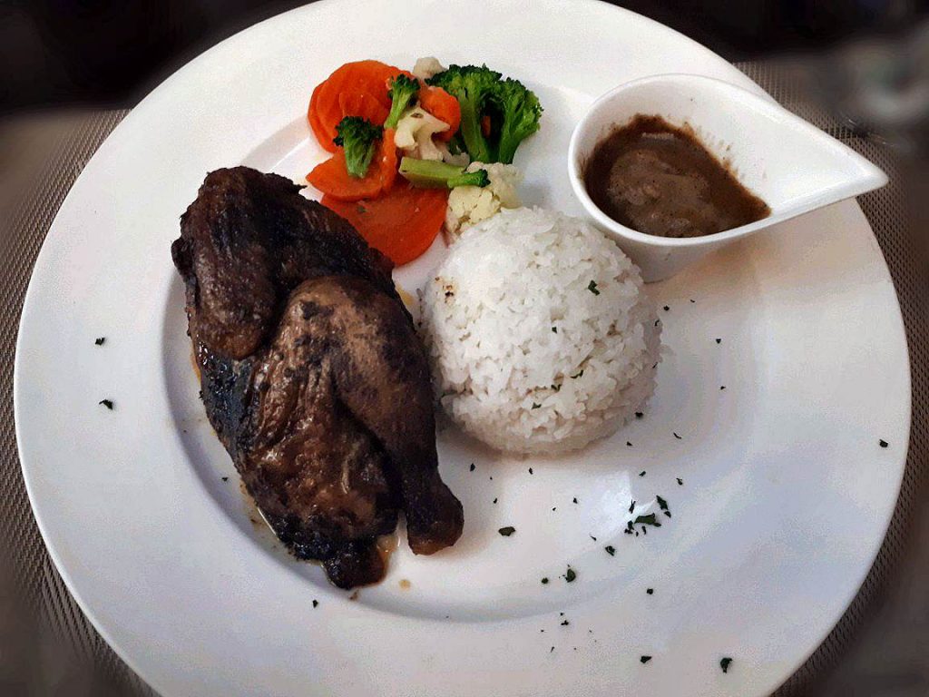 A delicious Roasted Chicken with rice and gravy found in the suite room in ayala cebu