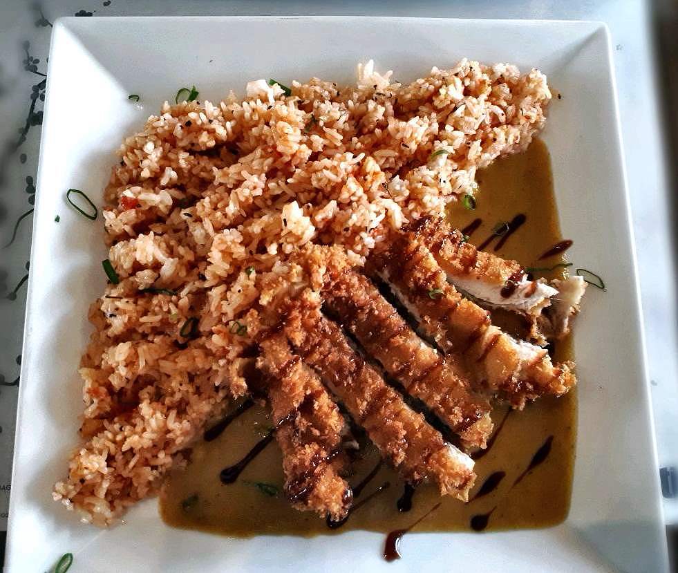 A chicken fillet with tomato rice and japanese curry called Chikita Katsu in Ilaputi