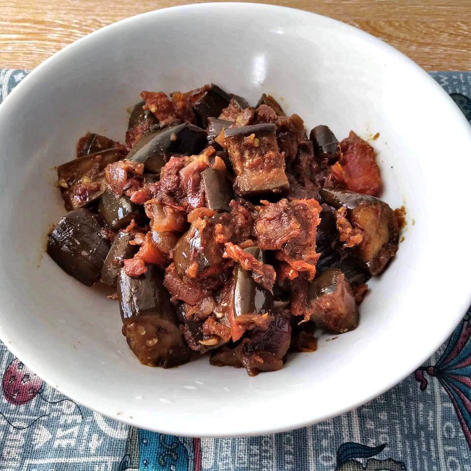 Spicy Eggplant Masala with tomatoes and other spices in a bowl