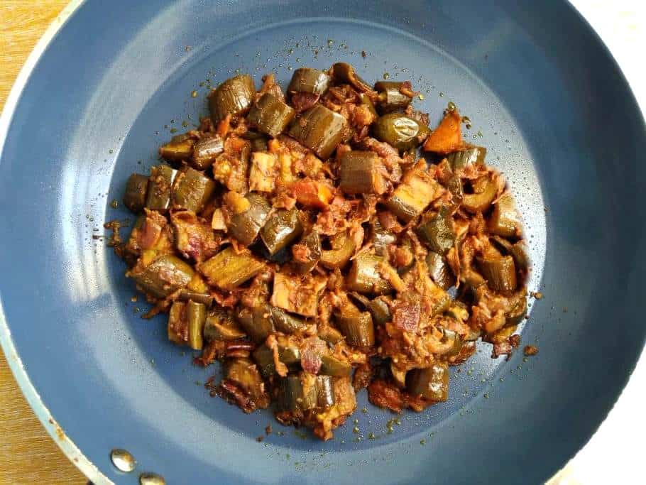 Spicy Eggplant Masala with tomatoes and other spices in a pan