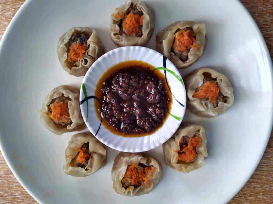 Beef Siomai Recipe garnished with grated carrots and serve with chili garlic oil.