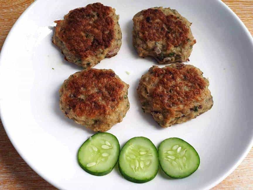 Chicken Kafta Patties with slices of cucumber in a plate