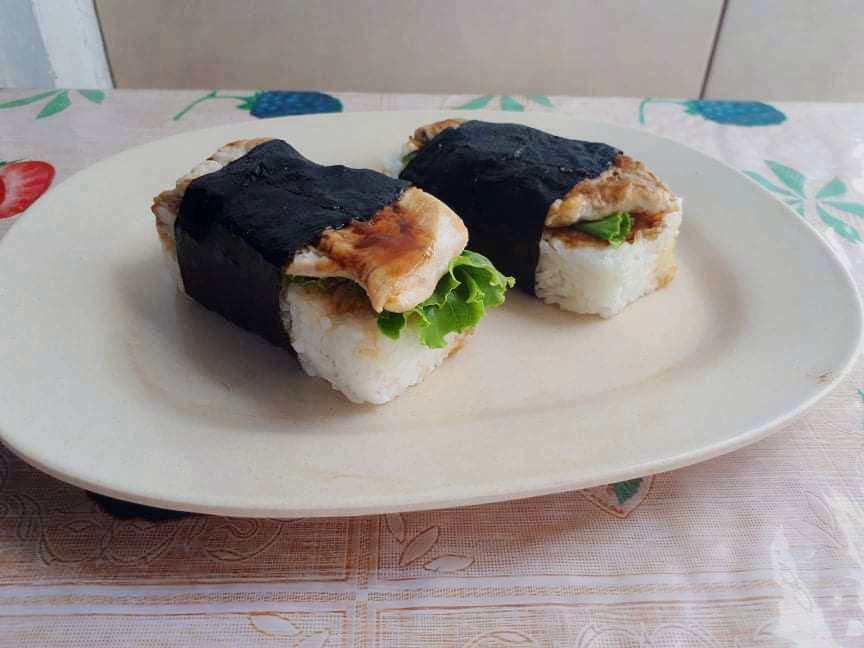 Chicken Musubi mixed with rice, chicken breast and lettuce wrapped in nori sheet