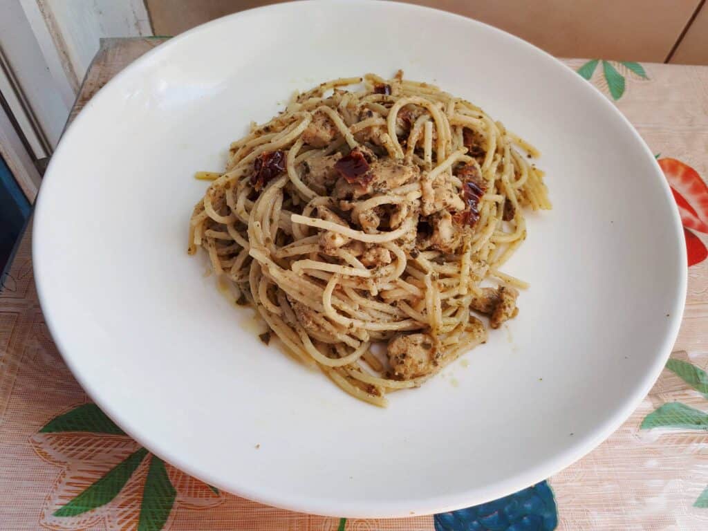 Chicken Pesto Pasta with Sun Dried Tomatoes recipe using spaghetti noodle served on a plate