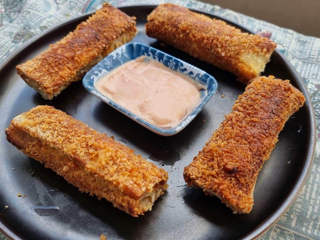 Chicken Bread Roll served with ketchup mayo sauce served on a plate