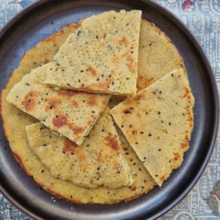 Algerian flatbread kesra with 4 pieces served on a plate