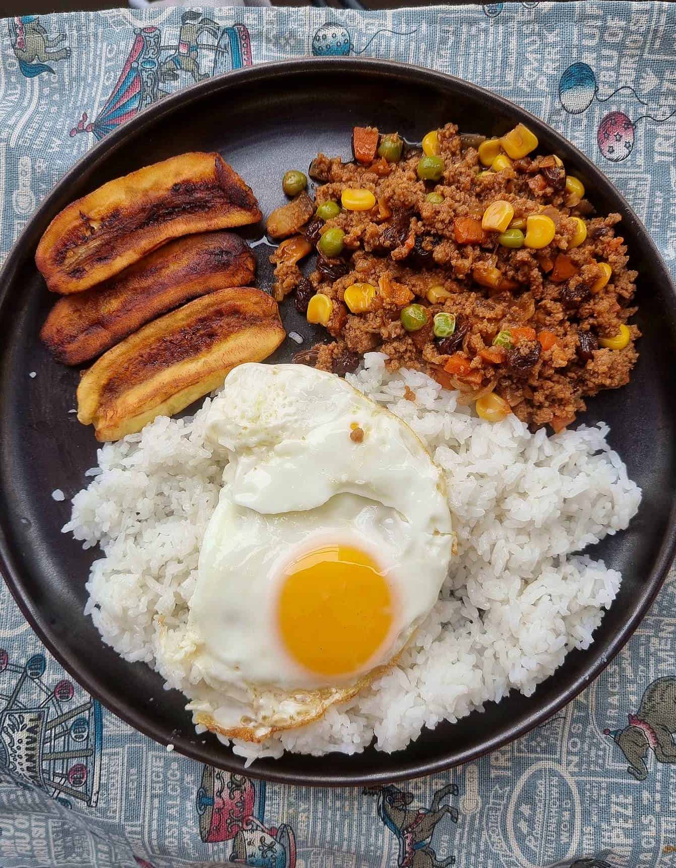 Filipino Arroz Ala Cubana recipe mixed with ground beef, fried plantain and white rice topped with sunny-side up egg